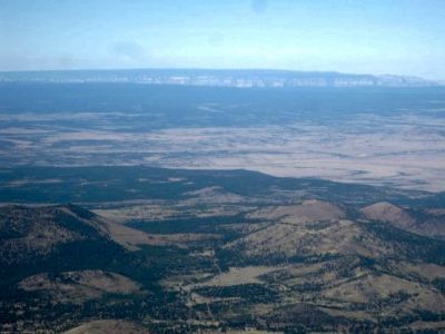 Climbing Humphreys Peak
View of north rim of the Grand Canyon in the background (about 60 miles away) 
